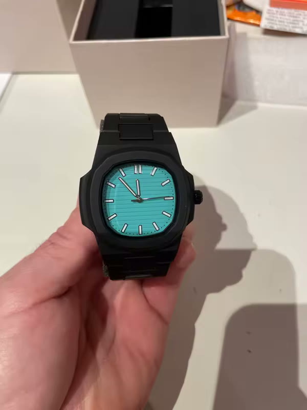 Customer photo: Stealth Black Taury watch held over its box